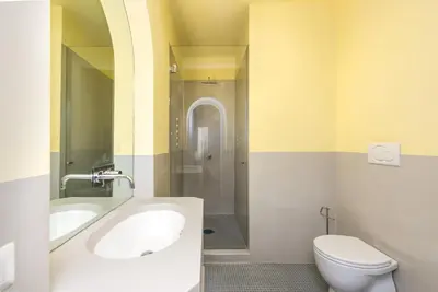 a bathroom with a tub and a toilet and a sink at My Spanish Steps Apartment - 2 bathrooms in Rome