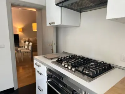 a kitchen with a stove top oven in a kitchen at My Spanish Steps Apartment - 2 bathrooms in Rome