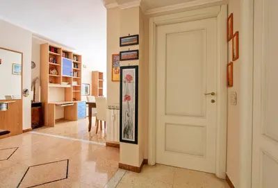 a kitchen and dining room with a table and chairs at Suite Porta Portese in Rome