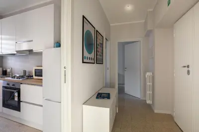 a kitchen with white cabinets and a counter in it at CASA VACANZA San LO' ZONA SAN LORENZO TERMINI ROMA in Rome