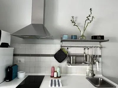 a kitchen with a sink and a counter top at Casa Vivi in Rome