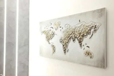 a metal world map on a wall at Turati Inn in Rome