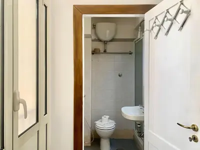 a bathroom with a toilet and a sink at DaliTourism - Vatican Apartment 118 in Rome