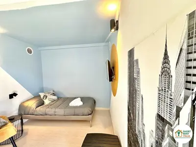 a small room with a bed and a wall with a city at Corso Francia - Exclusive House in Rome