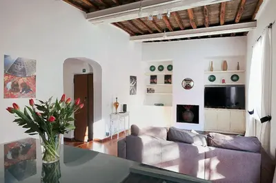 a living room with a couch and a table at Pantheon Terrace 2 BR Apartment in Rome