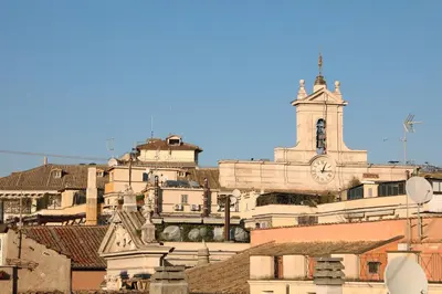 a group of buildings with a church and a clock tower at Pantheon Terrace 2 BR Apartment in Rome