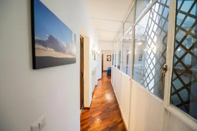 a hallway of a house with a large window at Pantheon Terrace 2 BR Apartment in Rome