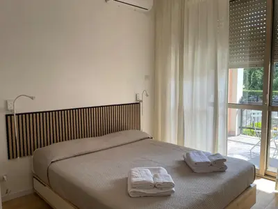 a bedroom with a bed with two towels on it at Vatican New home in Rome in Rome