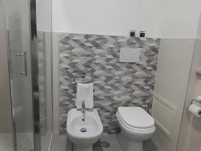 a bathroom with a toilet and a shower at Your Place in Trastevere in Rome
