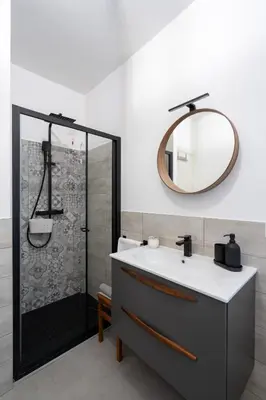 a bathroom with a sink and a shower with a mirror at Your Place in Trastevere in Rome