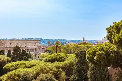 a view of a city with trees and a building at Elysium Suites Colosseo in Rome