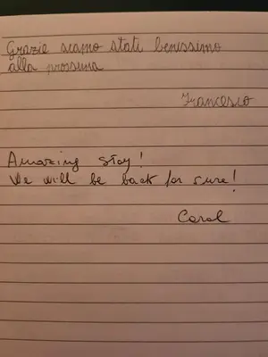 a piece of white paper with handwriting on it at Domus Mariposa in Rome