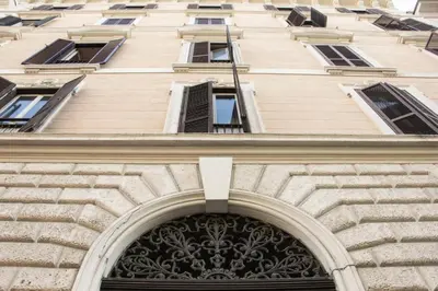a large building with an arch over a door at Ciao Collection in Rome