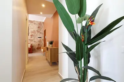 a plant in a vase in a hallway at Zelo Apartment by Nosdom Properties in Rome