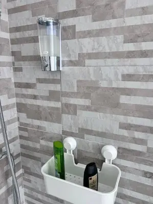 a bathroom with a sink with bottles in it at Maison Monferrato in Rome