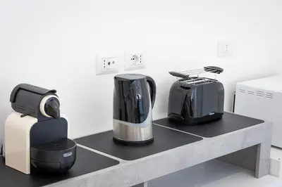 a counter with a coffee maker and a toaster at Baldo by Rental in Rome in Rome
