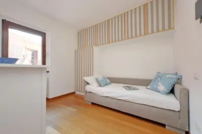 a living room with a couch and a window at Via dell'Orso Charme - My Extra Home in Rome