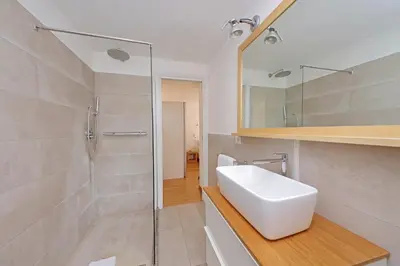 a bathroom with a sink and a glass shower at Via dell'Orso Charme - My Extra Home in Rome