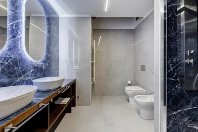 a bathroom with two sinks and two toilets at BMGA l Ottaviano Lux 3Bdr Apartment in Rome