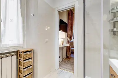 a bathroom with a shower and a sink and a mirror at NEW Vatican BIG apartment - ROMEDREAMHOME in Rome