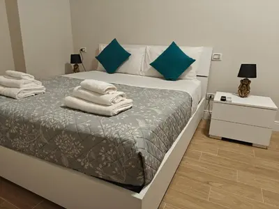 a bedroom with a bed with towels on it at Premium One-Bedroom Apartment plus sofa bed, Near Vatican - newly renovated in Rome