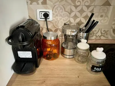 a counter with a coffee maker and other kitchen items at Premium One-Bedroom Apartment plus sofa bed, Near Vatican - newly renovated in Rome
