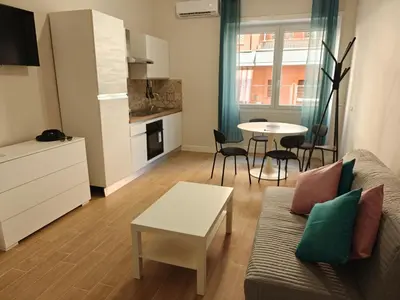 a living room with a couch and a table at Premium One-Bedroom Apartment plus sofa bed, Near Vatican - newly renovated in Rome