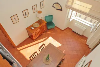 an overhead view of a living room with a table and chair at Appartamento 