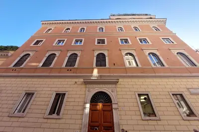a tall brick building with a door in front of it at Appartamento 
