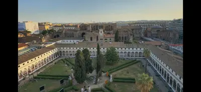 a view of a building with trees and a courtyard at Greta's house in Rome