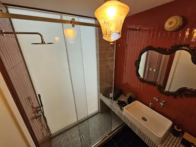 a bathroom with a sink and a mirror at Home Rome Borsieri in Rome