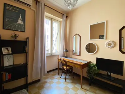 a home office with a desk and a mirror at Appartamento tipico Romano - Rione XXII Apartment in Rome