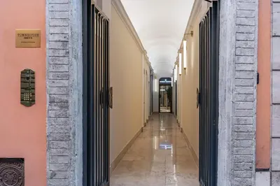 an aisle of an empty hallway in a building at Townhouse Condotti 29 in Rome