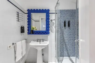 a bathroom with a sink and a mirror at Townhouse Condotti 29 in Rome
