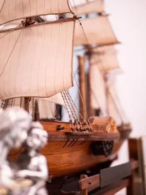 a model of a wooden ship on a table at ConTe Green House - 2 Apartments in Rome