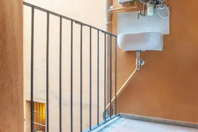 a balcony with a sink on the side of a building at Ciambella Atmosphere by Rental in Rome in Rome