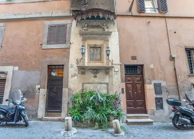 a building with two motorcycles parked in front of it at Ciambella Atmosphere by Rental in Rome in Rome