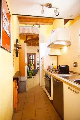 a kitchen with a sink and a stove at C&A Apartments - Authentic Trastevere in Rome