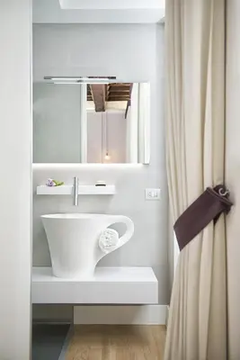 a bathroom with a sink and a mirror at Domus Libera in Rome