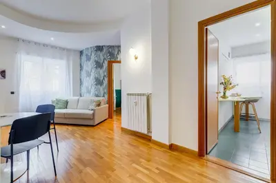 a bedroom with a bed and a table and chairs at Gaia's Place! in Rome