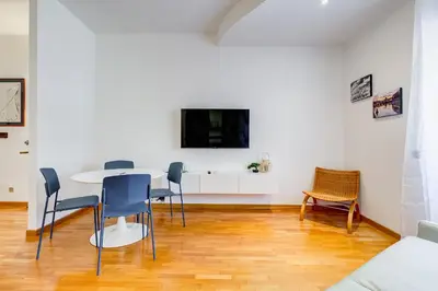 a kitchen and living room with a hard wood floor at Gaia's Place! in Rome
