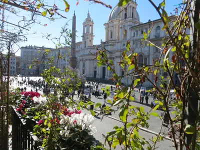 a building with a bunch of flowers in front of it at Appartamento Benincampi in Rome