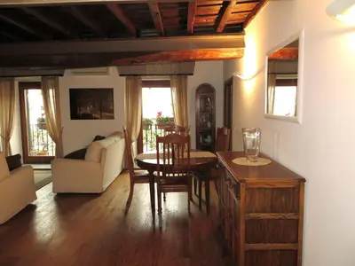 a living room with a table and a couch at Appartamento Benincampi in Rome