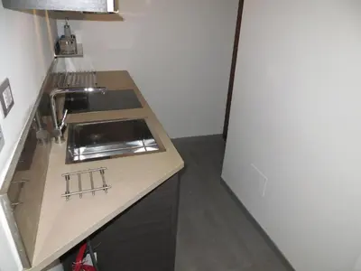 a small kitchen with a sink and a counter at Appartamento Benincampi in Rome