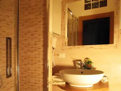 a bathroom with a sink and a mirror at Sweet Dreams in St Peter B&b in Rome