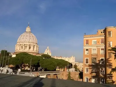 a view of the st francis cathedral from the roofs of buildings at Sweet Dreams in St Peter B&b in Rome