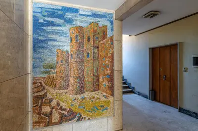 a large mosaic mural on a wall in a hallway at Appia Antica Park - Apartment with Terrace in Rome