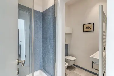 a bathroom with a shower and a toilet at Fresh House Fori Imperiali in Rome