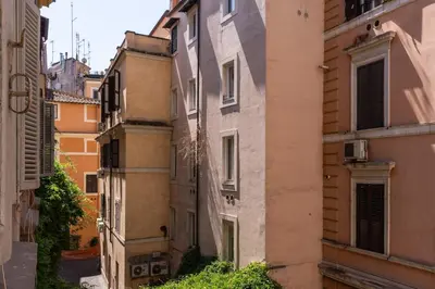 an alley between two buildings in a city at Fresh House Fori Imperiali in Rome