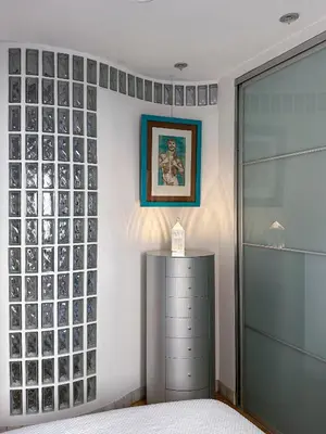 a room with a wall covered in glass blocks at Domus Alexander, Terrace Downtown Apartment in Rome